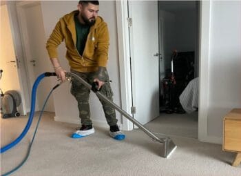 Carpet cleaning technician during work